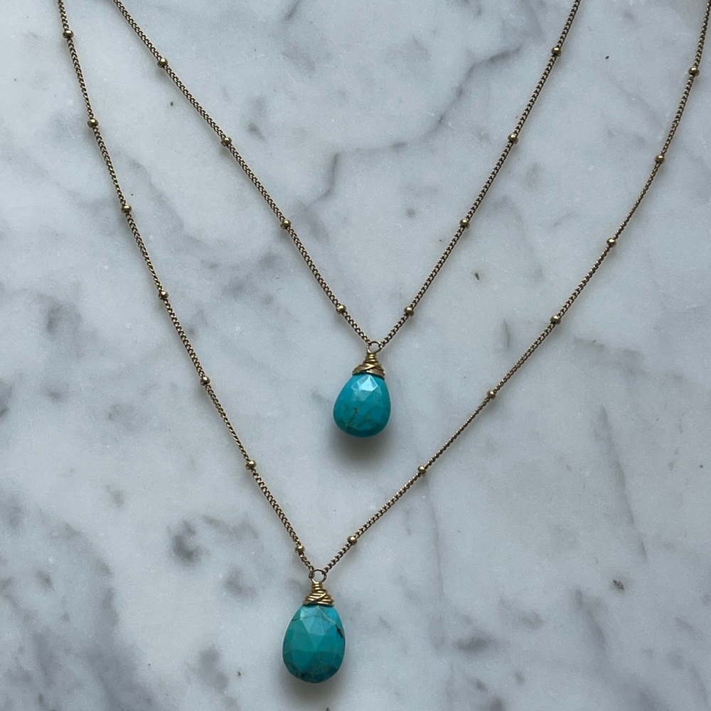 Two tier blue stone necklace.